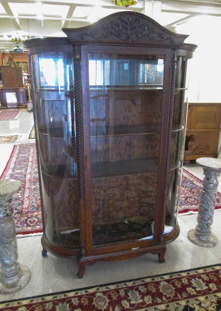 Appraisal: LATE VICTORIAN CARVED OAK AND CURVED GLASS CHINA CABINET American