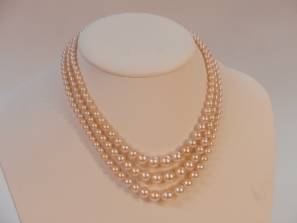 Appraisal: Ciro pearls triple strings and original case ct gold clasp