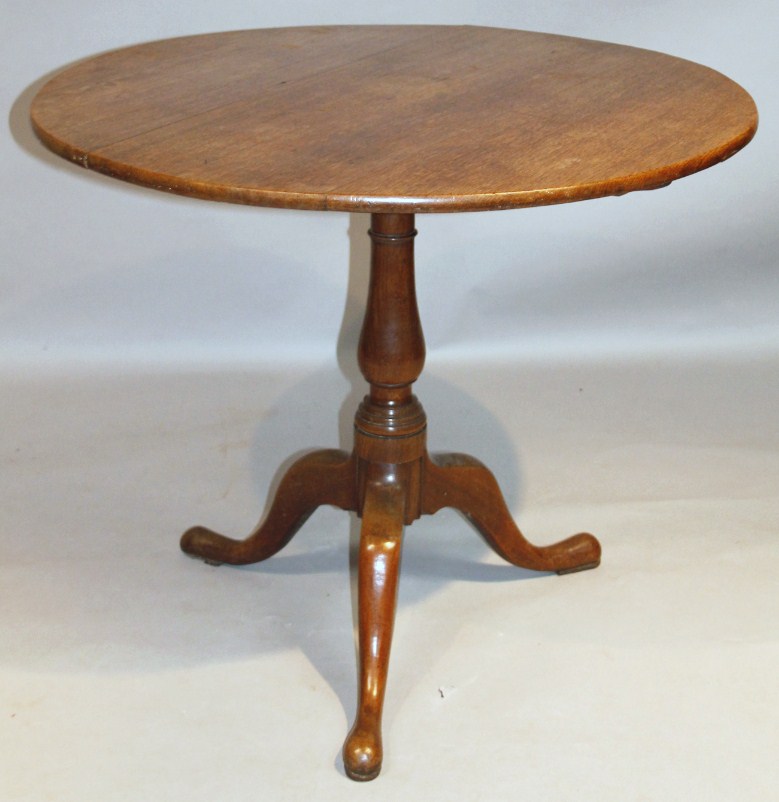 Appraisal: An thC oak occasional table the circular snap top raised