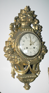 Appraisal: A GILT WOOD CARTEL CLOCK The dial signed Rob Engstrom