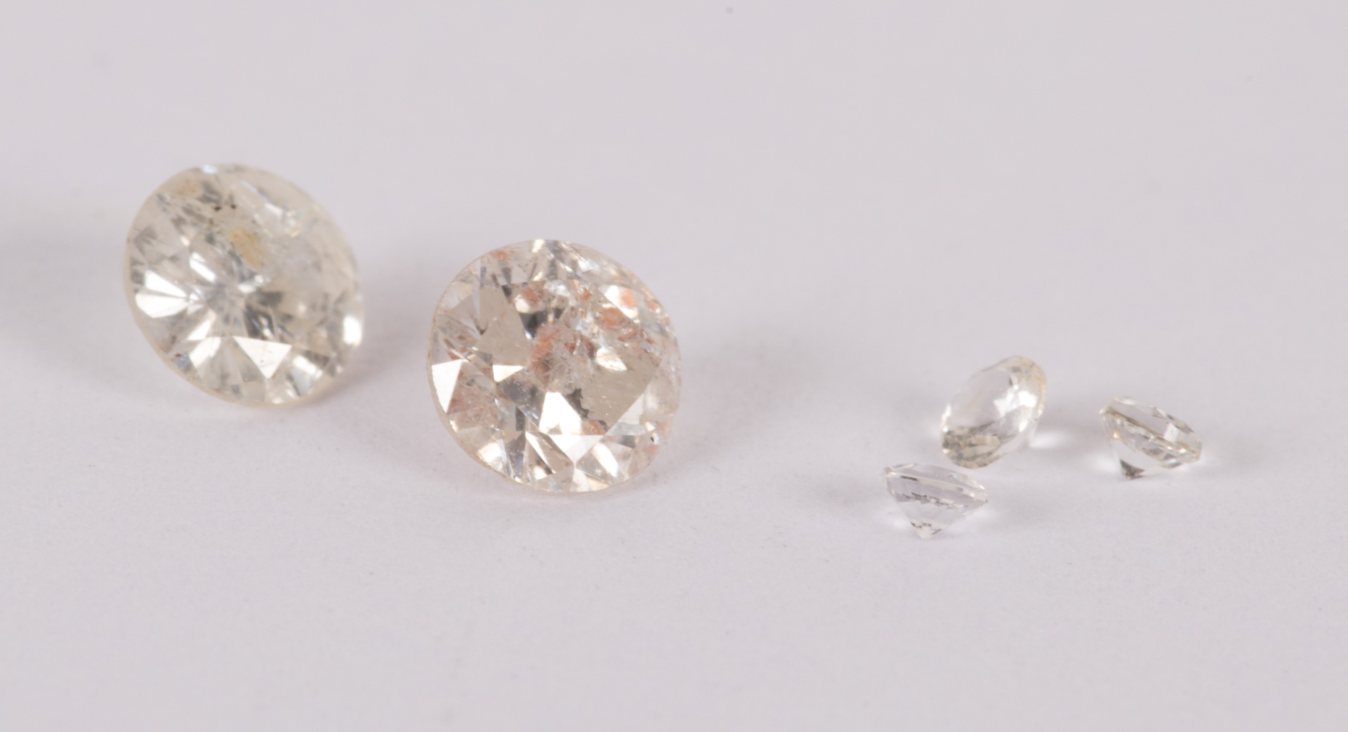 Appraisal: A Pair of Unmounted Diamonds Two round brilliant diamonds approximately