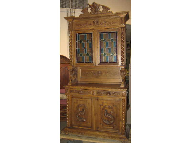 Appraisal: CONTINENTAL TH CENTURY OAK HUNT CABINET The tall buffet with