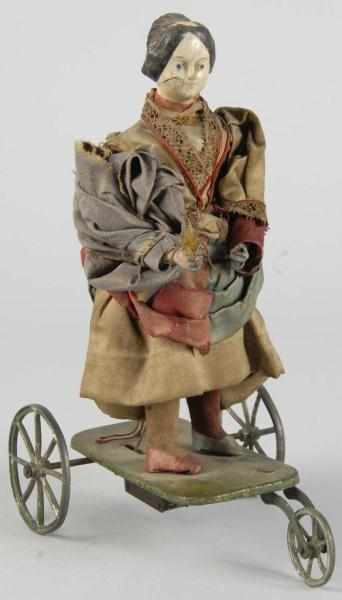 Appraisal: Woman on Platform Clockwork Toy Description Probably European Composition head