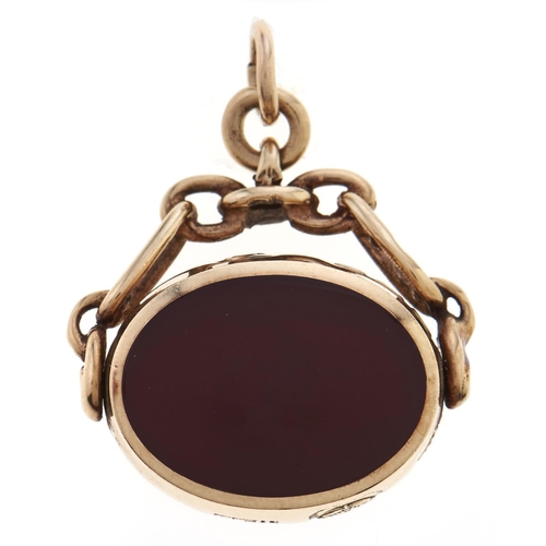 Appraisal: A ct gold watch fob swivel shield onyx and cornelian