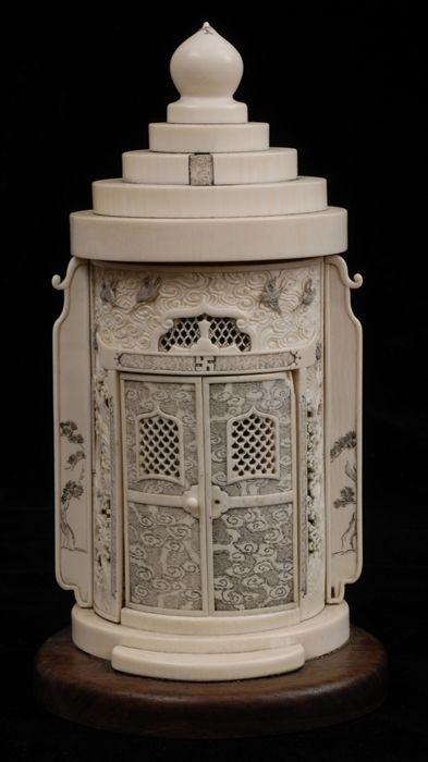 Appraisal: CHINESE CARVED AND INCISED IVORY HOUSEHOLD SHRINE The oval stepped