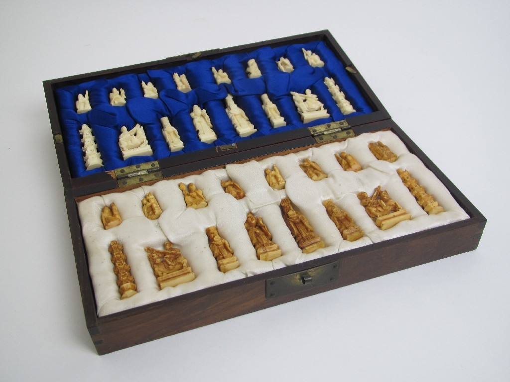 Appraisal: A Chinese carved ivory chess set carved with mandarins scholars