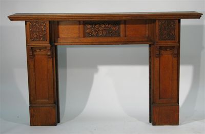 Appraisal: An English oak fire surround in the style of Arthur