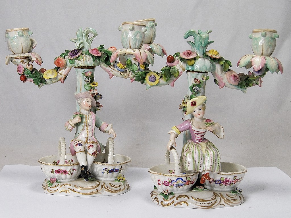 Appraisal: A pair of Dresden porcelain candelabra with floral encrusted stems