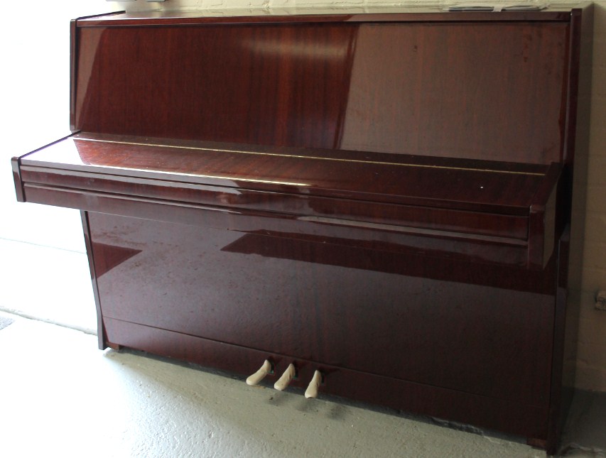 Appraisal: A modern Petrof upright piano in polished mahogany finish case