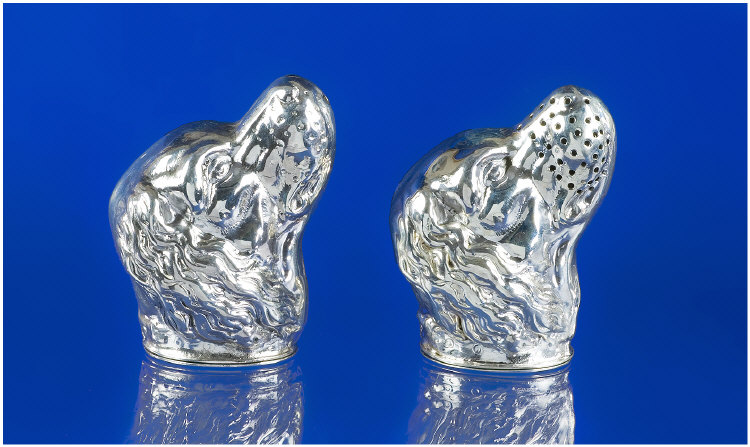 Appraisal: Silver Salt And Pepper Pots Modelled As Dogs Heads Stamped