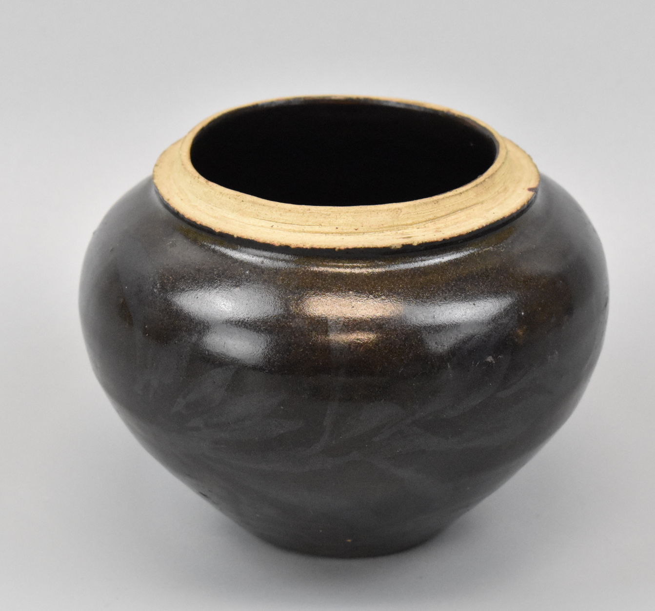 Appraisal: A Chinese black glazed jar dating from the Yuan dynasty