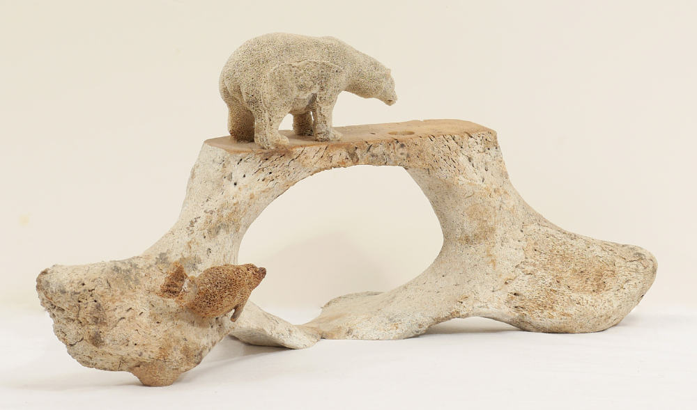 Appraisal: INUIT WHALE VERTEBRA CARVING Whale vertebra carved with figural polar