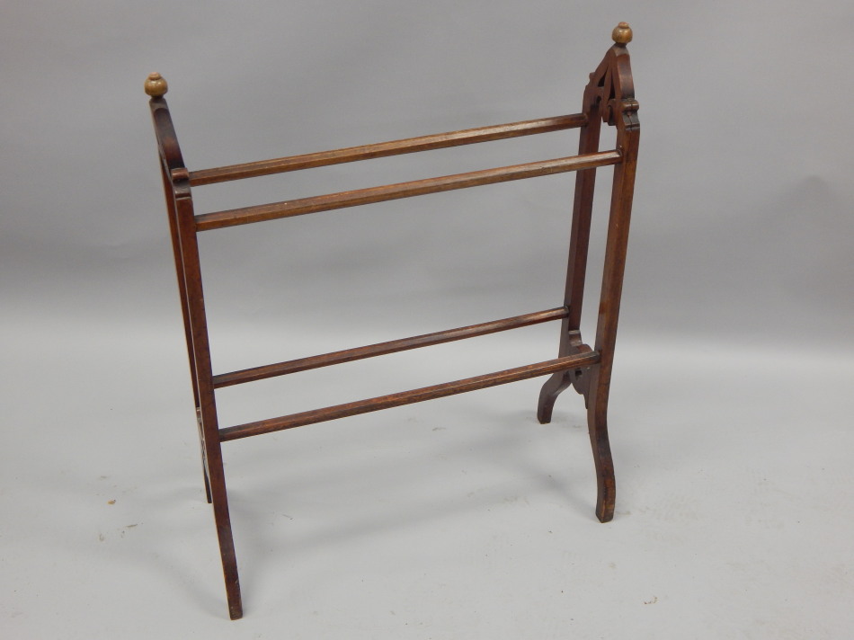 Appraisal: A Victorian mahogany towel rail in Gothic style with shaped