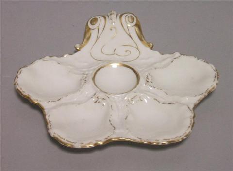 Appraisal: OYSTER DISH The shaped white dish with four shaped sections