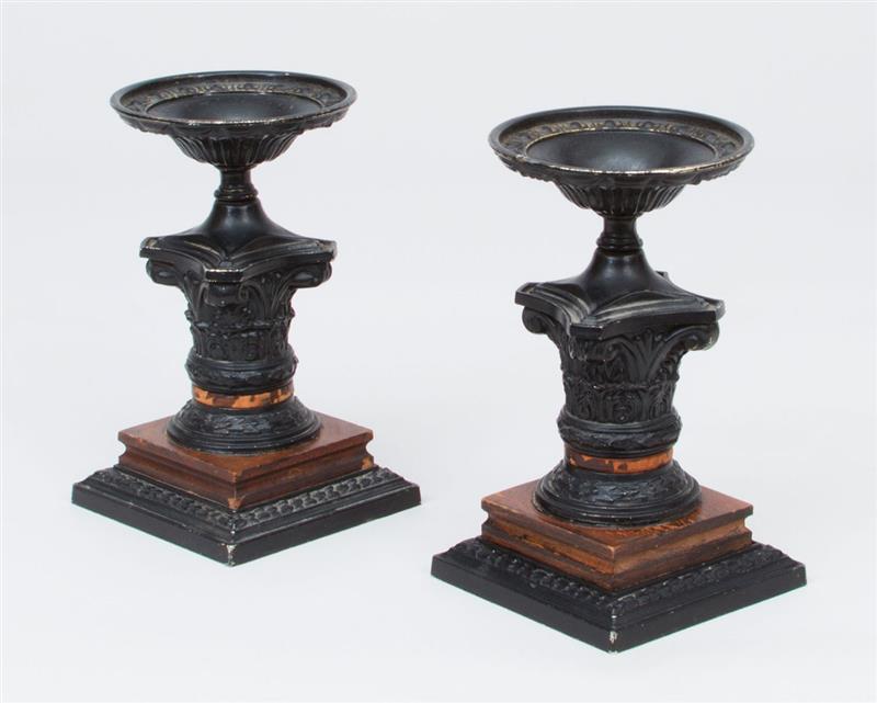 Appraisal: PAIR OF AMERICAN EBONIZED METAL CANDLE HOLDERS With Corinthian capital