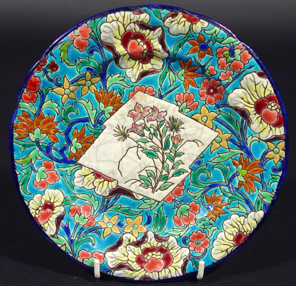 Appraisal: Longwy plate hand enamelled with flowers onto a turquoise ground