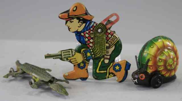 Appraisal: ASSORTED TIN TOY LOT Includes Lehmann Gnome Snail Cowboy clicker