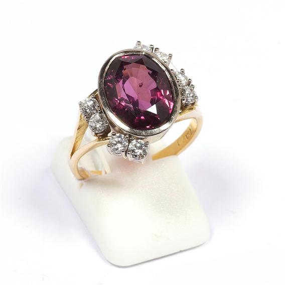 Appraisal: GARNET AND DIAMOND RING Yellow and white gold Casual ring