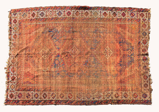 Appraisal: AN ANTIQUE QASHGAI CARPET with a central interlinked medallion within