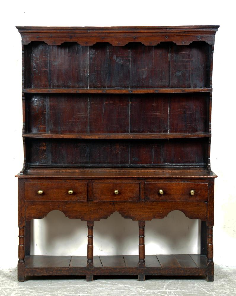 Appraisal: A GEORGE III OAK POTBOARD DRESSER South Wales c the