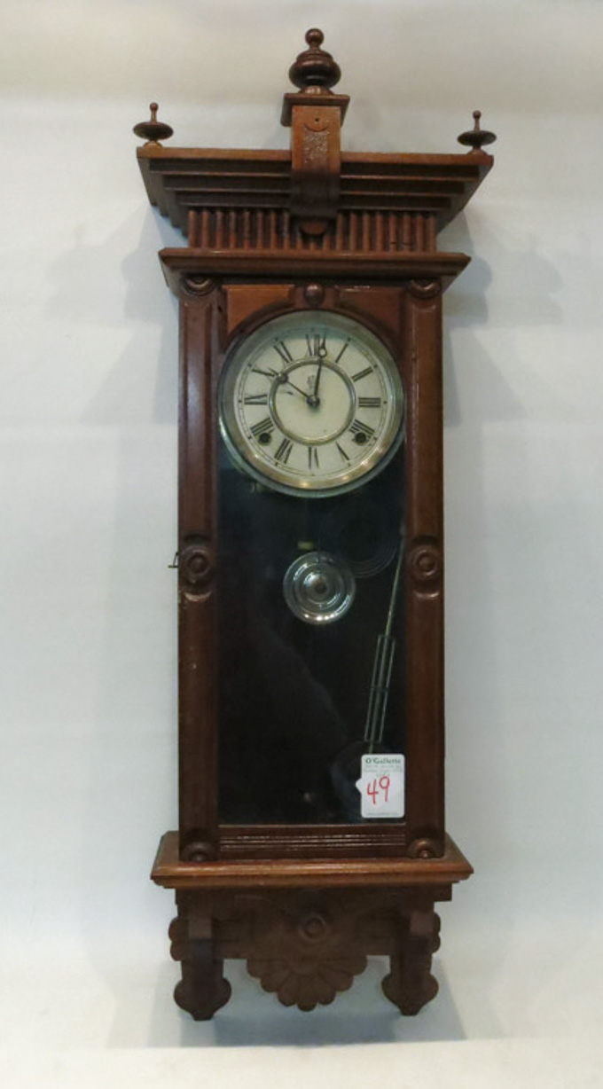 Appraisal: WATERBURY WALNUT CASE WALL CLOCK eight day spring wound time