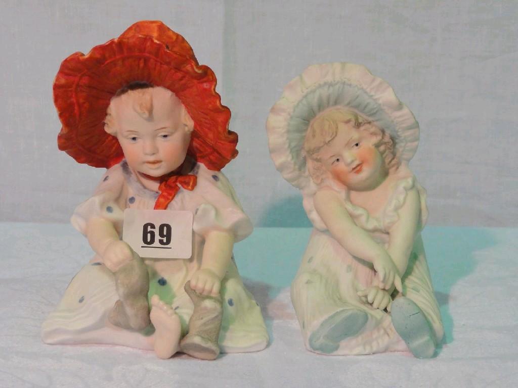 Appraisal: Two late th century continental bisque figures of little girls