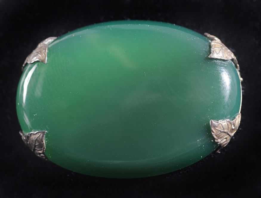 Appraisal: TRANSLUCENT GREEN OVAL CABOCHON SET IN STERLING PIN WITH LEAF-SHAPED