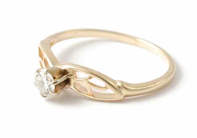 Appraisal: DIAMOND AND FOURTEEN KARAT GOLD SOLITAIRE RING featuring a round