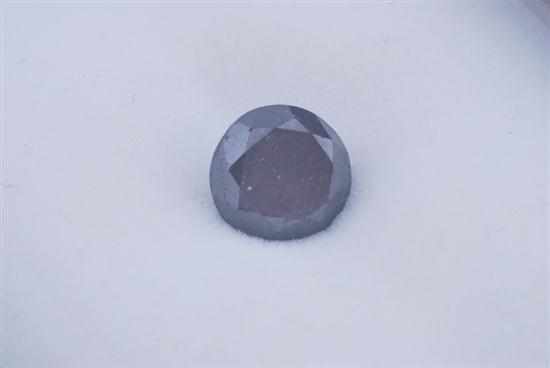 Appraisal: A LOOSE BLACK DIAMOND WEIGHING APPROXIMATELY CTS