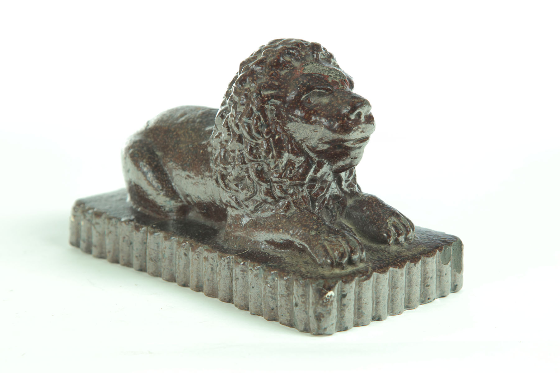 Appraisal: SEWERTILE LION Ohio early th century Recumbent lion on a