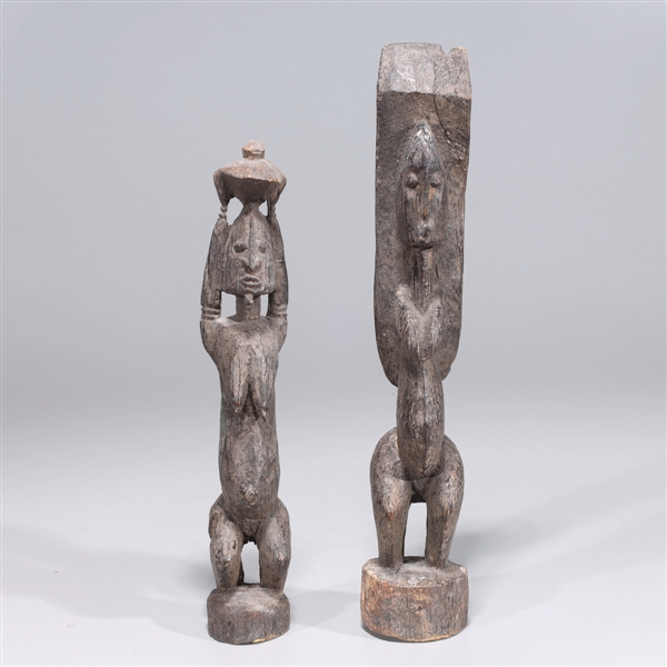 Appraisal: Pair of carved wood African tribal standing figures overall good