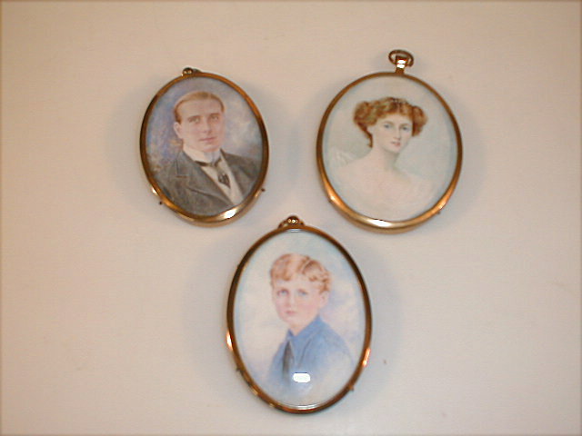 Appraisal: Group of three family portrait miniatures The lady signed R