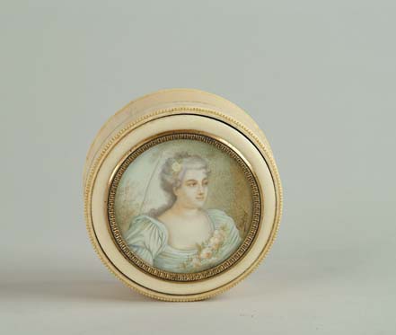 Appraisal: ROUND IVORY DRESSING BOX WITH IVORY MINIATURE PAINTING Round painting