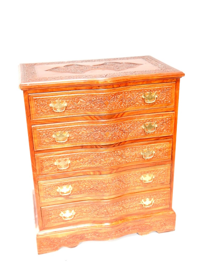 Appraisal: A mahogany serpentine fronted carved chest of drawers having relief