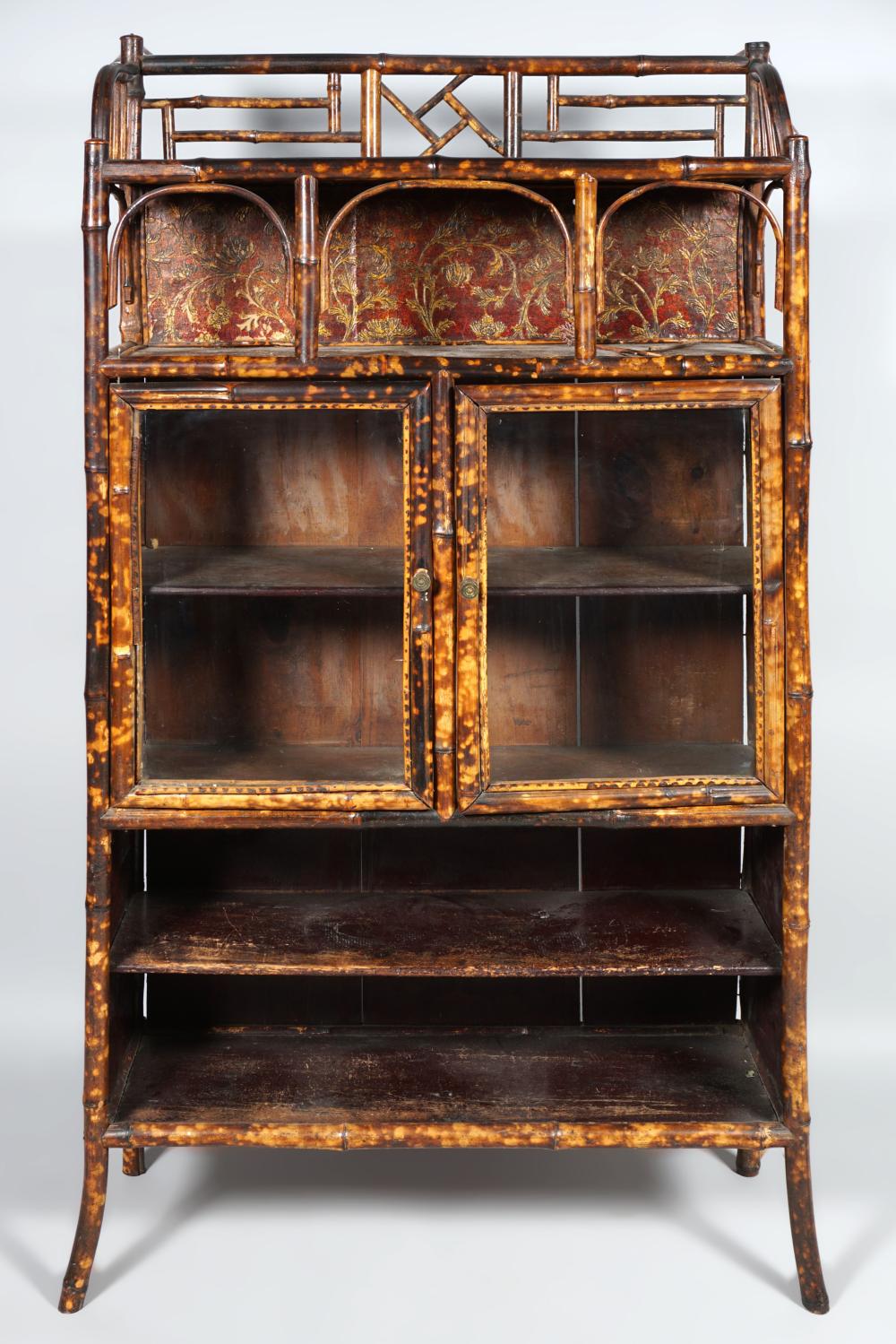 Appraisal: RATTAN AND PRESSED PAPER CABINET the rectangular galleried top above