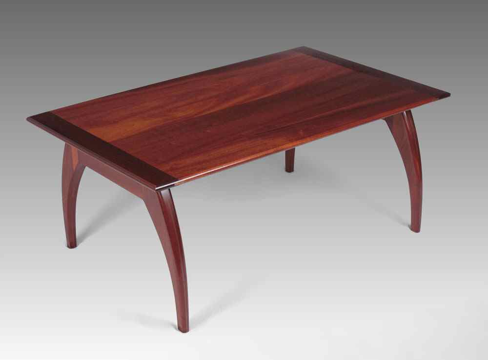 Appraisal: AMERICAN CRAFTSMAN MODERNIST MAHOGANY COFFEE TABLE Mahogany top shaped legs