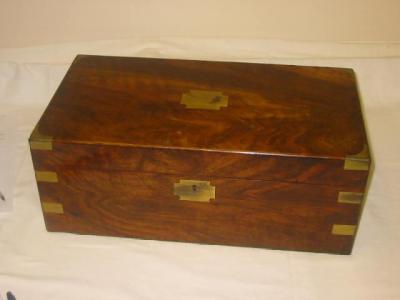 Appraisal: A MAHOGANY WRITING SLOPE with brass corners and blank cartouche