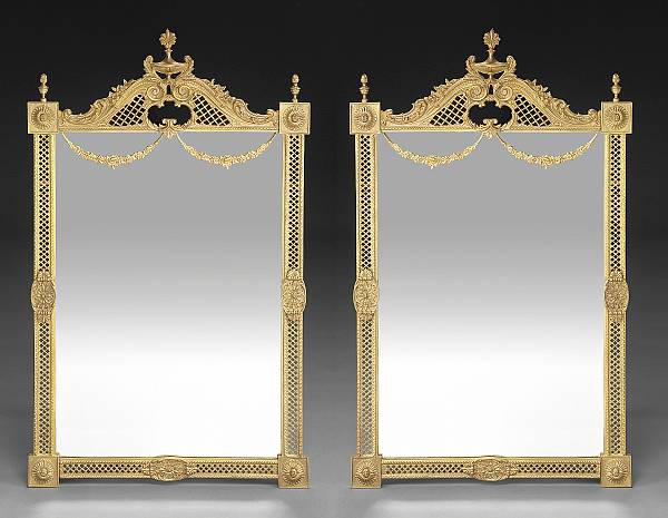 Appraisal: A pair of Neoclassical style gilt bronze mirrors The rectangular