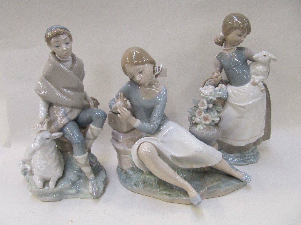 Appraisal: Three Lladro figures to include boy with sheep girl carrying