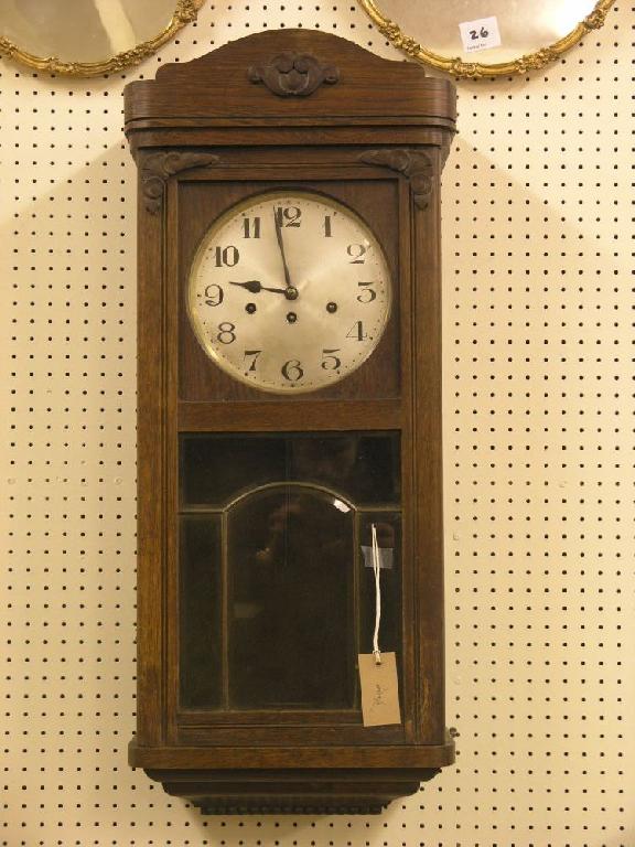 Appraisal: A 's oak wall hanging hall clock silvered dial trunk