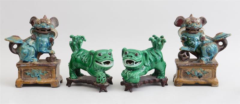 Appraisal: PAIR OF CHINESE GREEN-GLAZED POTTERY FIGURES OF FU DOGS AND