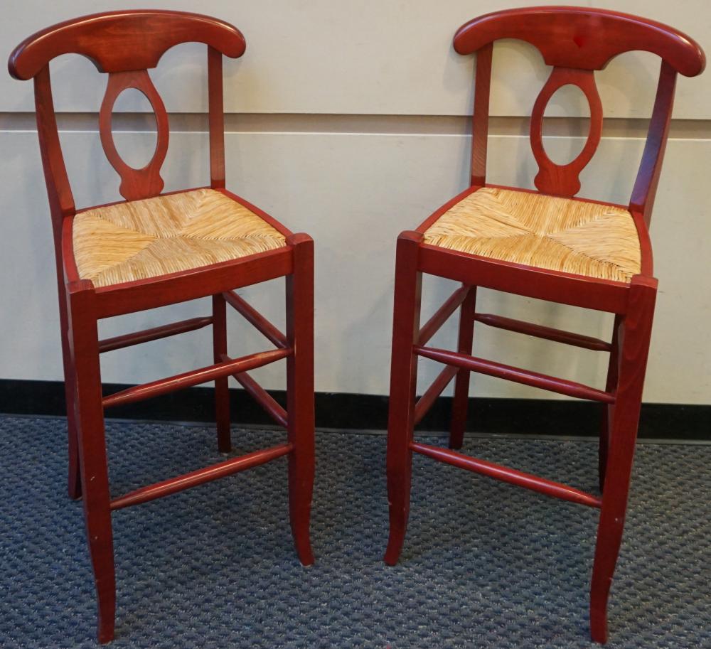 Appraisal: PAIR OF RED STAINED FRUITWOOD AND RUSH SEAT COUNTER STOOLS