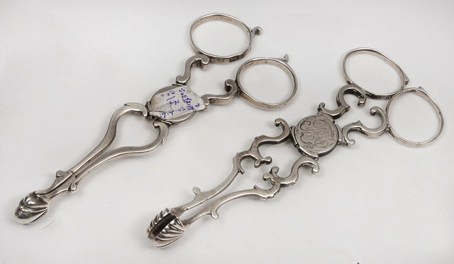 Appraisal: TWO PAIRS OF GEORGE III SILVER SUGAR NIPS one pair