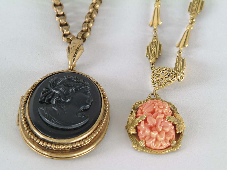 Appraisal: TWO COSTUME JEWELRY NECKLACES One with heavy chain and oval