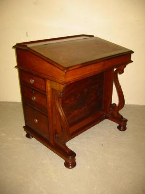 Appraisal: A MAHOGANY DAVENPORT the moulded edged hinged top with galleried