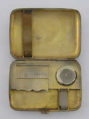 Appraisal: A plain combination silver cigarette case sovereign case and vesta