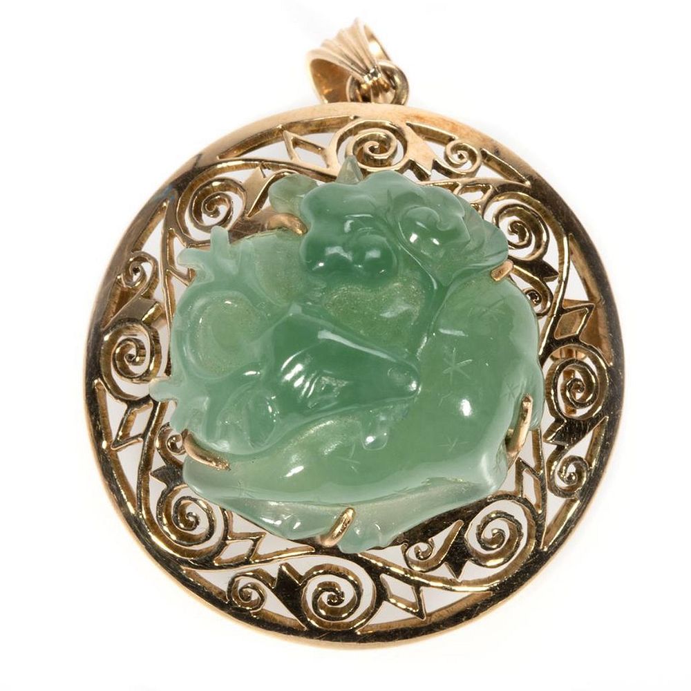 Appraisal: Carved green hardstone and k gold brooch-pendant originally a half