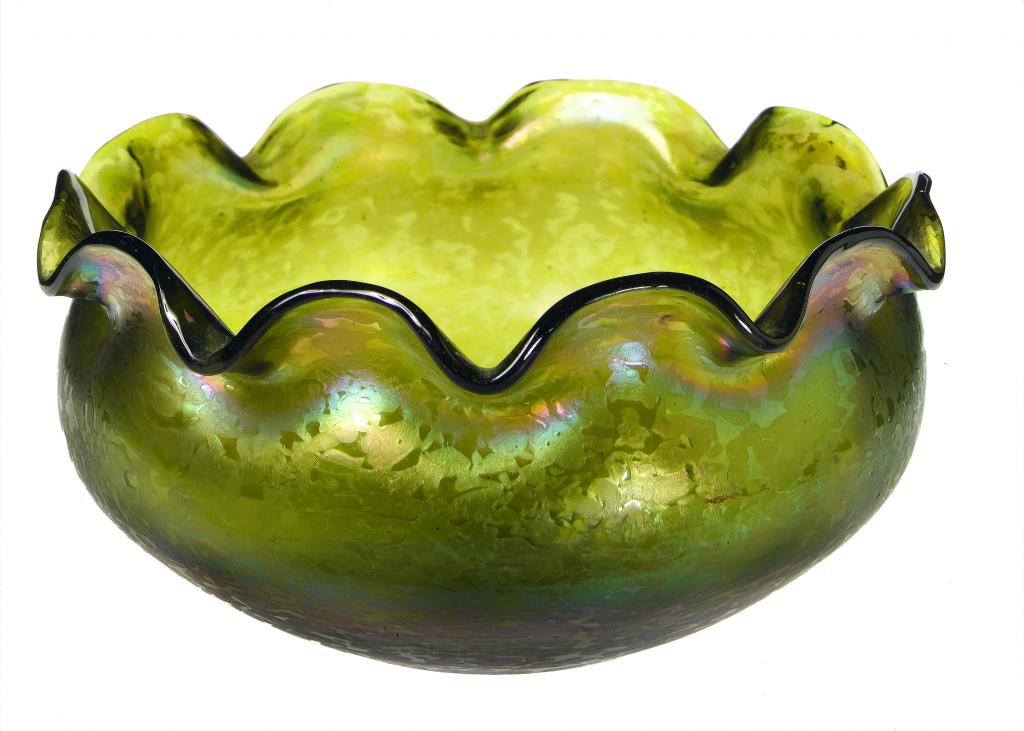 Appraisal: A BOHEMIAN IRIDESCENT GLASS BOWL of compressed form with waved