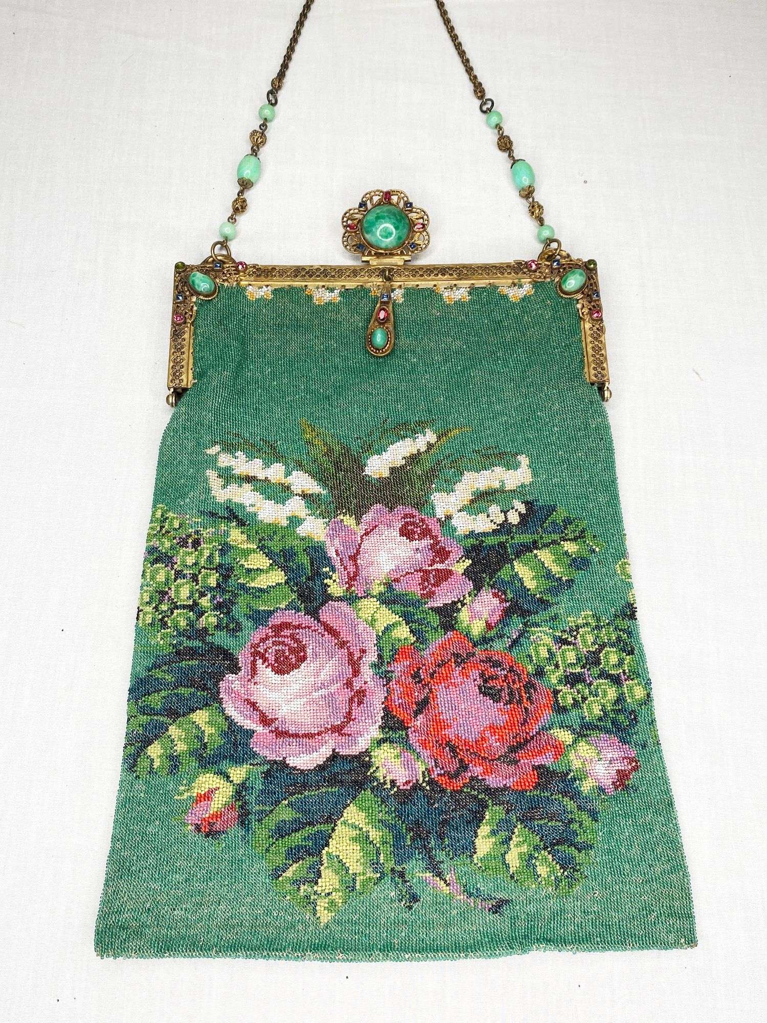 Appraisal: Micro Beaded Hand Bag with Roses and Jeweled Frame long