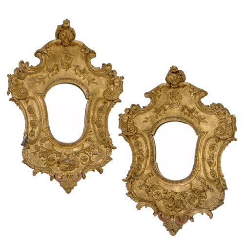 Appraisal: CONTINENTAL BAROQUE STYLE Pair of hanging mirrors of carved wood